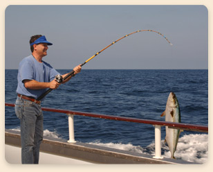 Fisherman Deep Sea Fishing off Los Roques, catching a big fish.