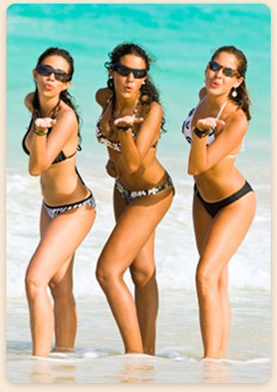 Women on the beach in Los Roques, Venezuela